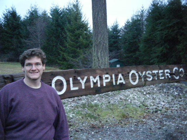 Intrepid Scientist at Olympia Oyster Company sign.